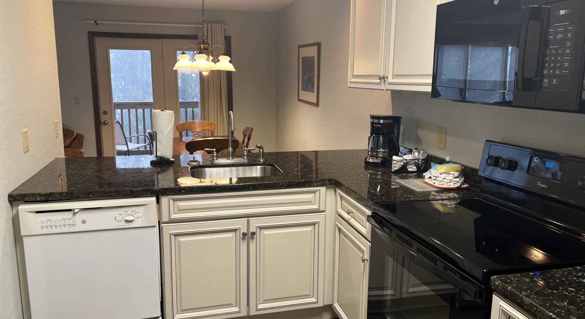 Kitchen Overlooking Dining Room and Balcony